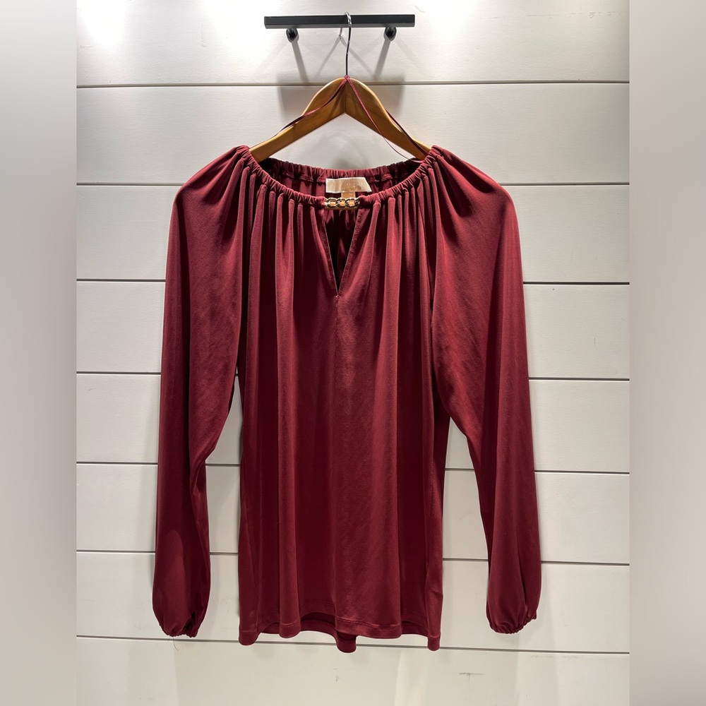 Michael Kors maroon top with gold chain accent